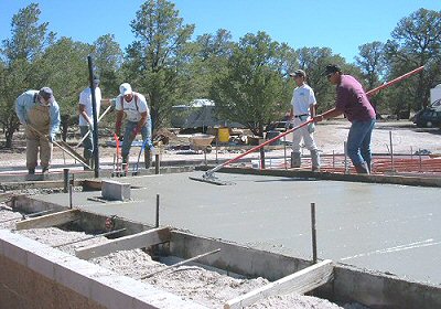 Photo of the crew pouring concrete