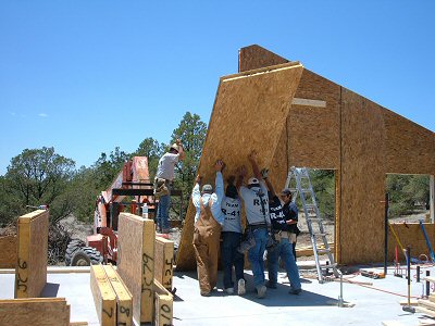 Photo of a work crew setting up a structural panel home